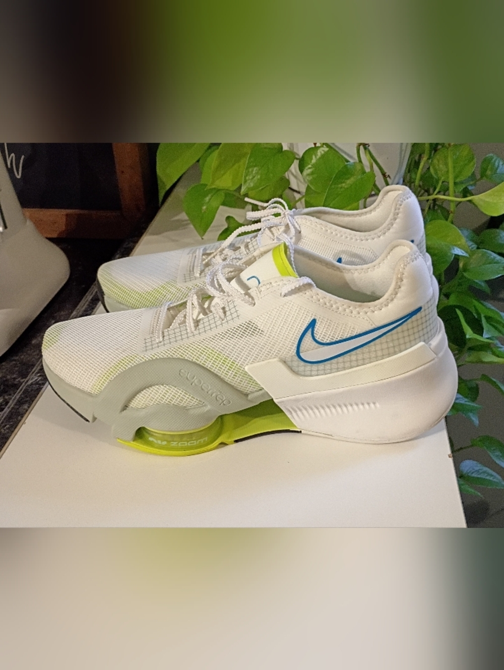 Nike White Sneakers with Blue Swoosh and Lime Accents